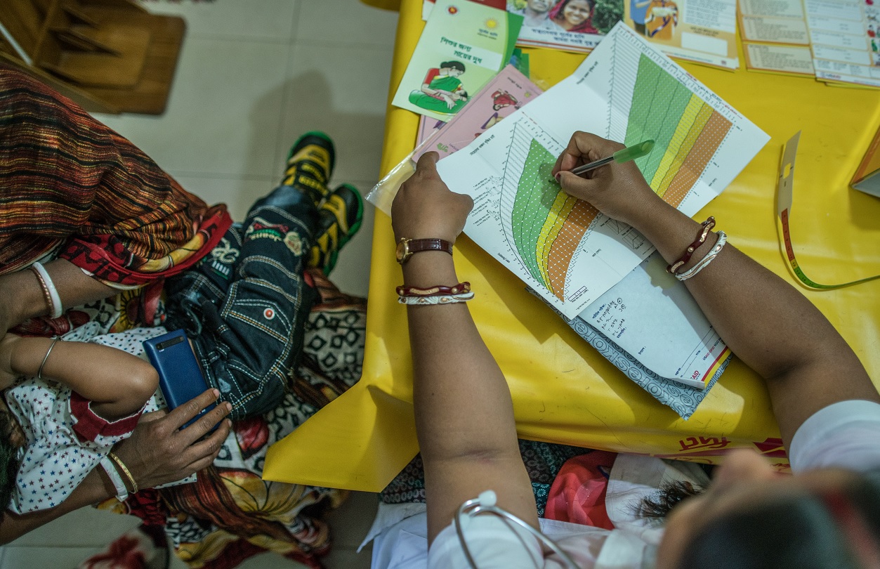 A health care worker meets with a client