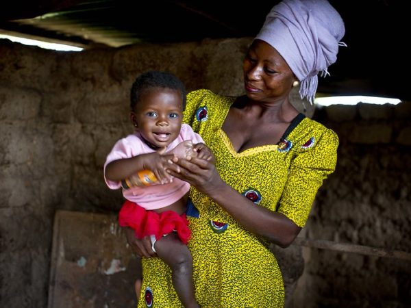 Here, Rahama, 30, plays with her 9-month-old daughter, Maradiatu, inside their home.