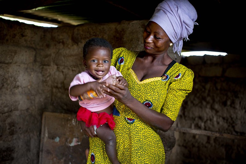 Here, Rahama, 30, plays with her 9-month-old daughter, Maradiatu, inside their home.