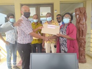 Jhpiego Country Director (Dr Birhanu) handing over laptop to the JFKMC Medical Records Director (Mrs Attoh). Photo credit: JFKMC