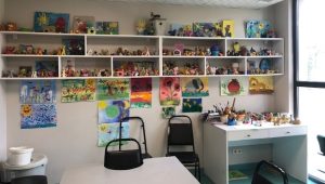 A rehabilitation room in Georgia with paintings and toys