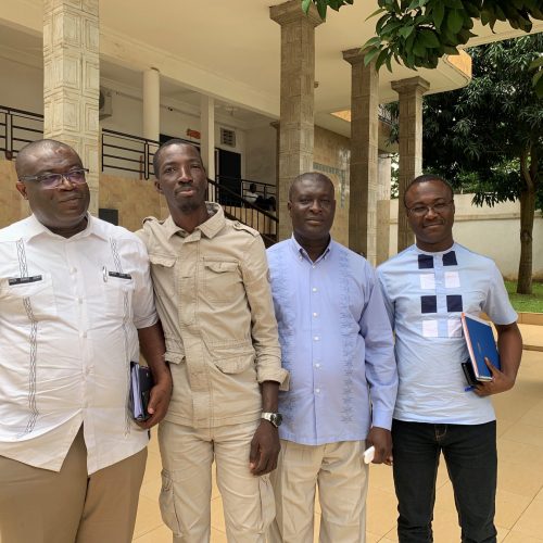 Local partner, Global Challenge Corporation and the Fonds Nationin kickoff work on sustainable financing for HIV in Abidjan Four men standing outside
