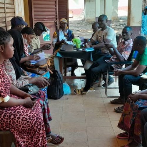 Community health workers in Guinea gather for a workshop