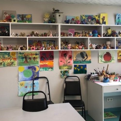 A rehabilitation room in Georgia with paintings and toys