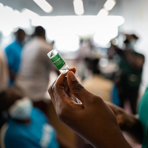 COVAX rollout: COVID-19 vaccinations begin in Ghana - nurse prepares vaccine
